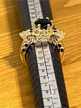 Goth style gold tone ring skull wings black onyx like glass  size 6